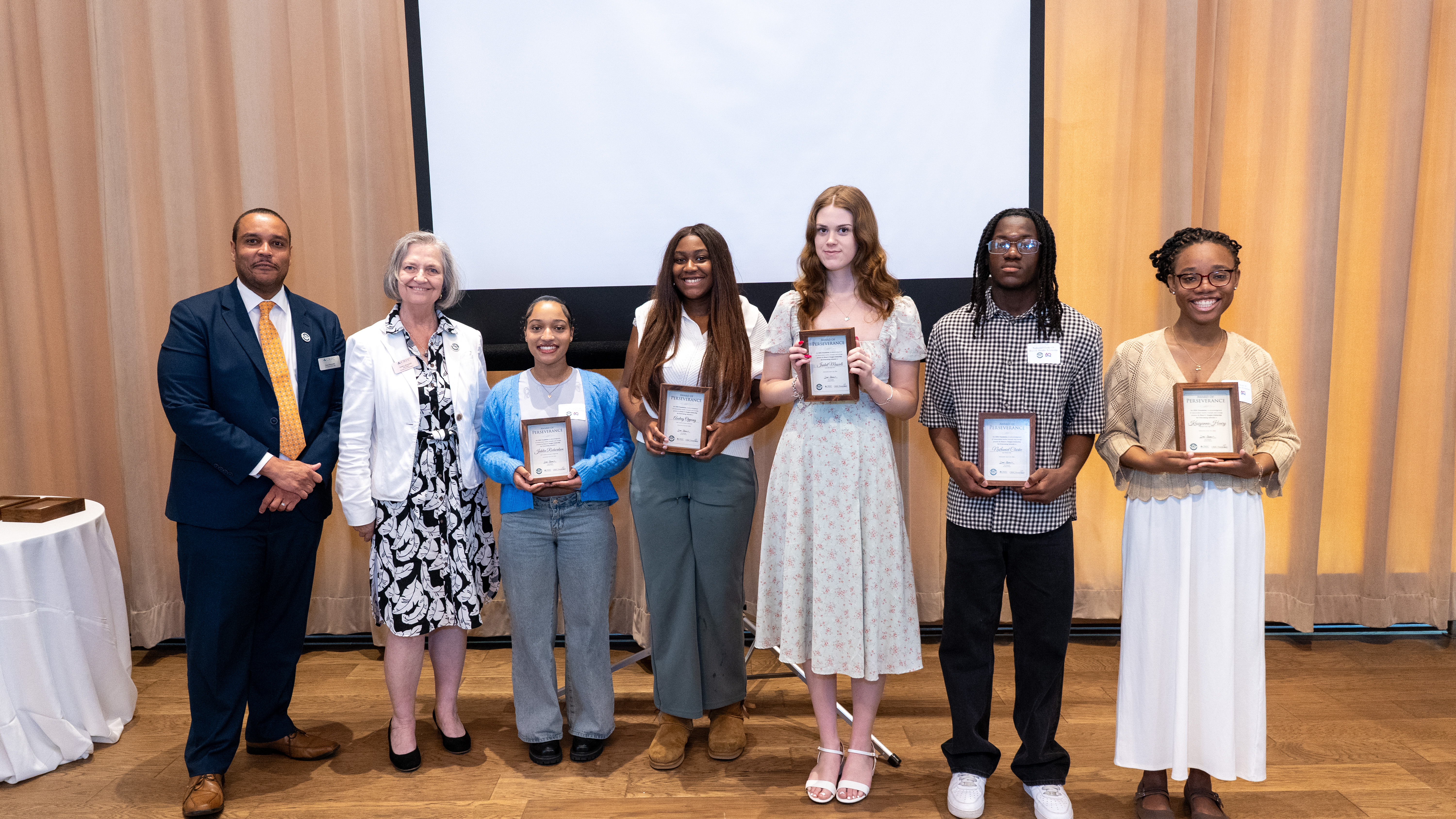 A photo of our Scholarship winners alongside CREC Executive Director Desi Nesmith