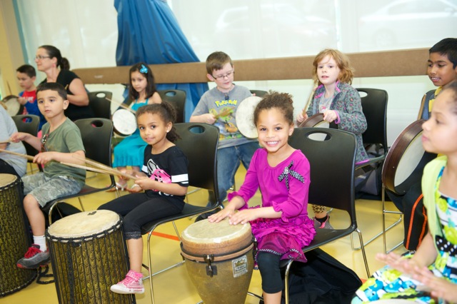 Woman playing Latin percussion